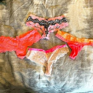 4 pairs of assorted Victoria’s Secret lacy thongs size small
